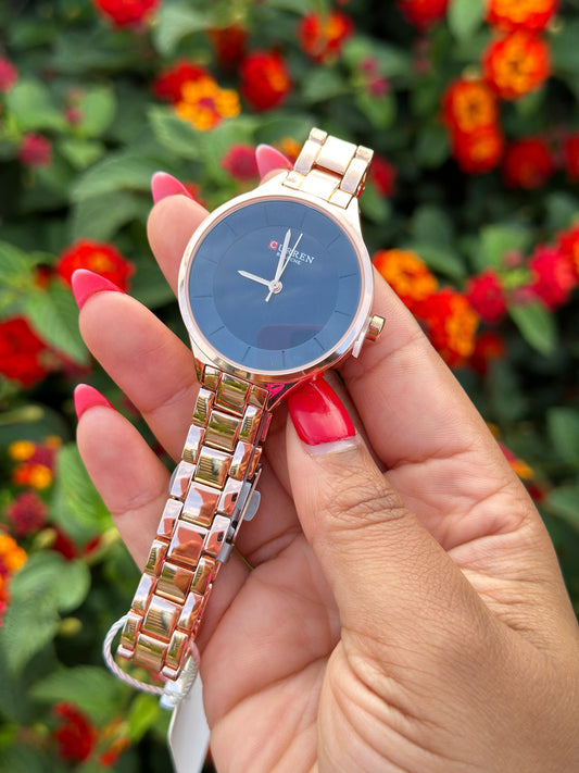 Curren watch round face